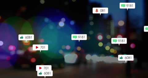 Social Media Notifications on Blurred City Street