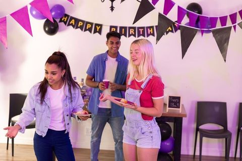 Diverse Teens Celebrating Birthday with Laughter and Colors