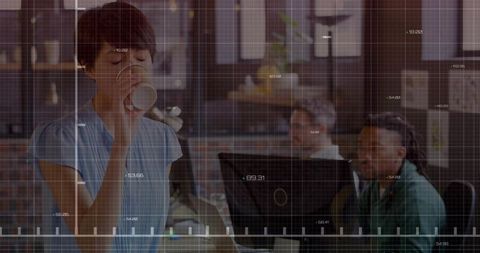 Professional Asian Woman Engaging in Office Break Amid Tech Setting