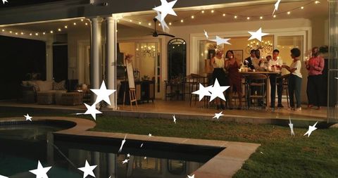 Backyard party by pool with friends holding sparklers, gathering under string lights
