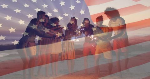 Friends Celebrating with Sparklers at Dusk by Beach