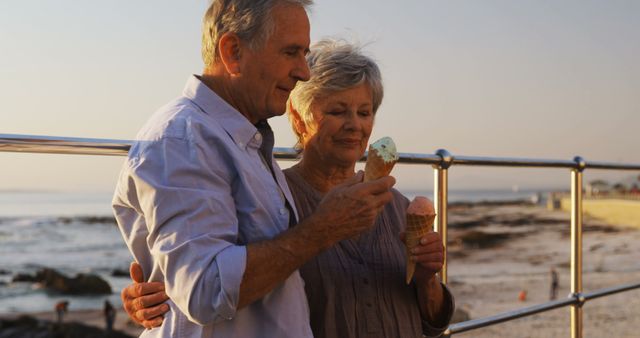 Senior Couple Enjoying Ice Cream at Sunset by the Beach - Download Free Stock Images Pikwizard.com