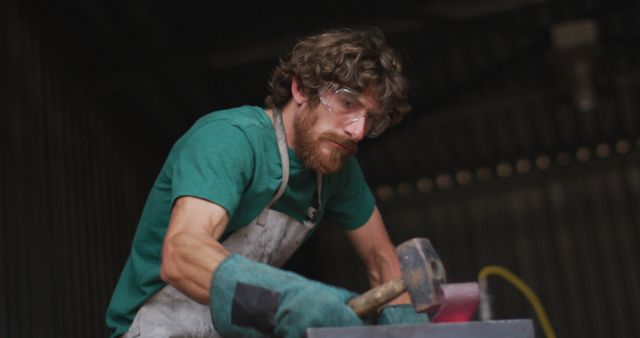 Blacksmith Crafting Metal with Hammer in Workshop - Download Free Stock Images Pikwizard.com