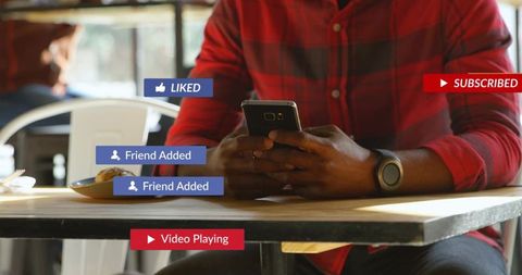Man tapping smartphone at cafe with social media like friend subscribe badges
