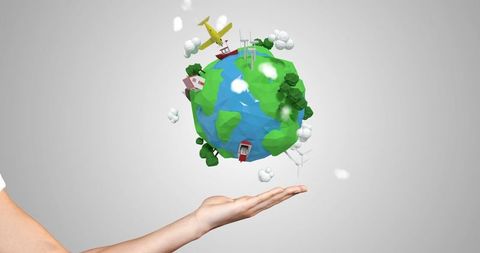 Hand Holding Eco-Friendly Representation of Earth with Windmills and Solar Panels