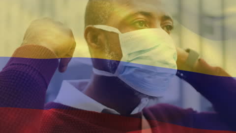 Man Wearing Face Mask with Waving Colombian Flag Overlay