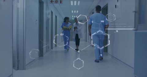 Walking medical team discussing notes in hospital corridor with molecular graphics overlay