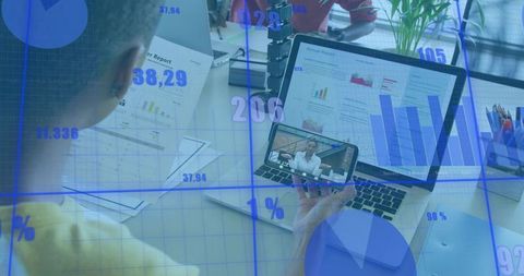 Professional analyzing remote meeting and business charts on phone and laptop with blue data overlay