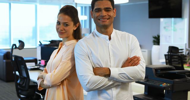 Confident Business Colleagues Standing with Arms Crossed in Modern Office - Download Free Stock Images Pikwizard.com