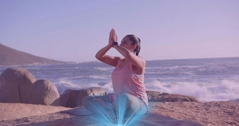 Woman Meditating at Rocky Coast with Tranquil Energy