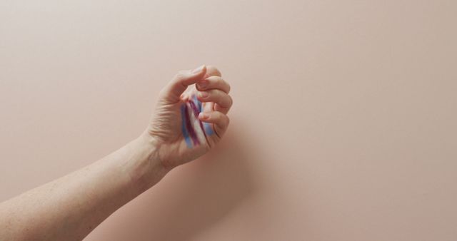 Image of hand of caucasian man with rainbow flag on pink background - Download Free Stock Photos Pikwizard.com