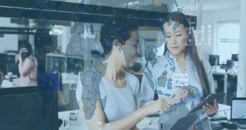 Female Analysts Collaborating with Digital Map Overlay