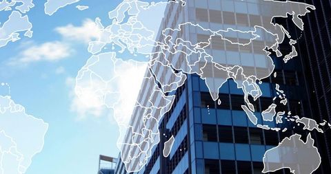 Global connectivity overlay on glass office tower skyline with translucent world map