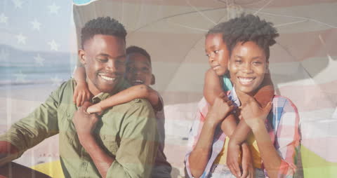 Joyful African American Family Enjoying Beach Under USA Flag Overlay