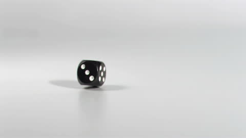 Black Dice Blur Effect in Super Slow Motion on Floor