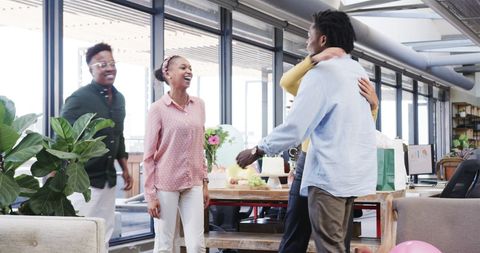 Birthday Celebration with Diverse Colleagues in Modern Office