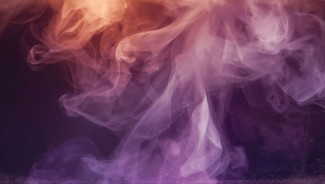 Ethereal Violet and Amber Smoke Swirls Creating Dreamy Abstract Background with Soft Particles