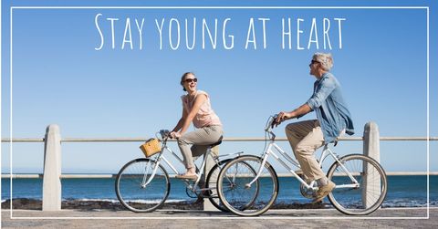 Joyful Senior Couple Cycling by Serene Seaside - Download Free Stock Templates Pikwizard.com