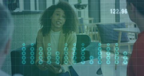 Female Leader Discussing Data Analytics in Modern Office Lounge