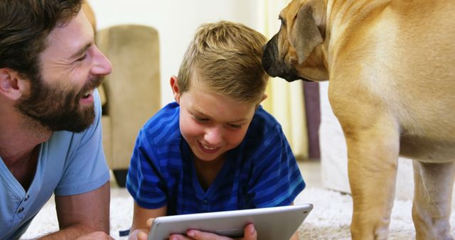 Family Bonding Time with Digital Tablet and Pet Dog Indoors - Download Free Stock Images Pikwizard.com