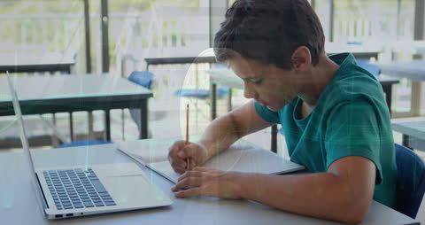 Boy Utilizing Laptop and Writing in Classroom Perspective