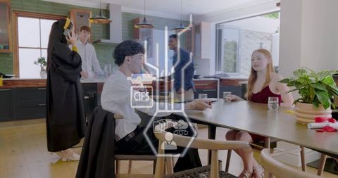 Young professionals socializing in modern kitchen showing gif interface overlay