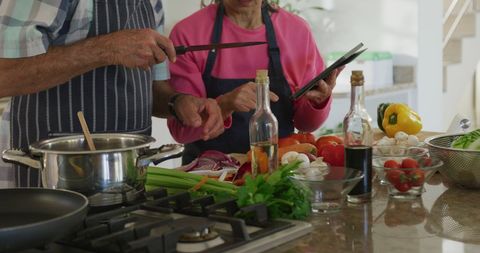 Senior Couple Cooking Together with Tablet Assistance - Download Free Stock Images Pikwizard.com