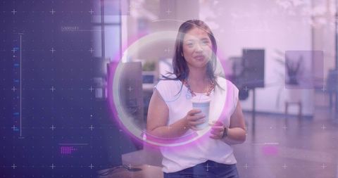 Woman with Coffee Embracing Technology in Modern Office Environment