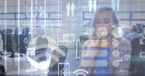 Business person surrounded by digital holographs, futuristic office setting