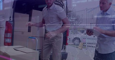 Delivery Personnel Organizing Cardboard Boxes for Transport