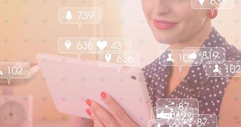 Woman Engaging with Social Media on Tablet, Displays Notify Counts