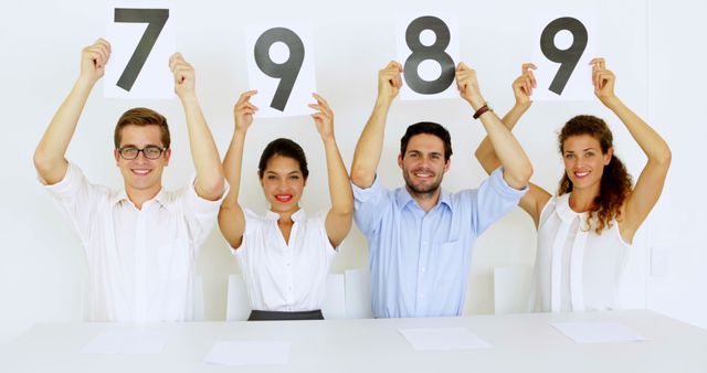 Group of Diverse Judges Holding Scorecards with Numbers - Download Free Stock Images Pikwizard.com