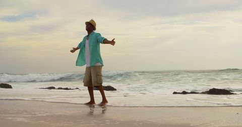 Man Enjoys Solitude on Rugged Coastline - Download Free Stock Images Pikwizard.com