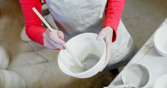 Hands Painting Ceramic Bowl with White Glaze in Pottery Studio - Download Free Stock Images Pikwizard.com