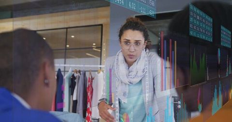 Fashion Designer Presenting Data Insights in Modern Studio