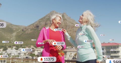 Senior women enjoying beach day surrounded by social media notifications