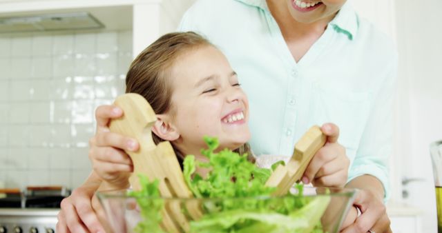 Mother and Daughter Preparing Fresh Salad Together - Download Free Stock Images Pikwizard.com