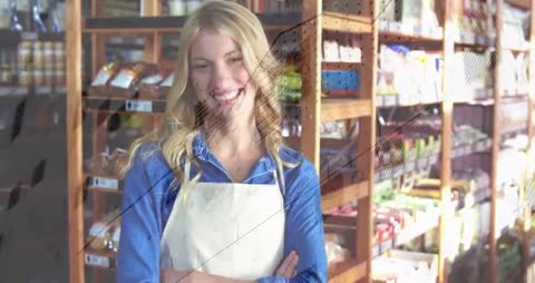 Grocery clerk smiling and crossing arms while camera tightens on wooden shelves