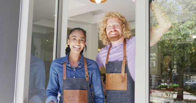 Smiling Restaurant Owners in Entrance Wear Aprons - Download Free Stock Images Pikwizard.com