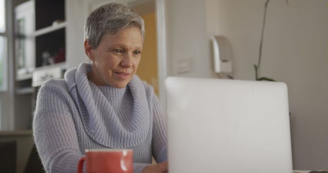 Senior Woman Using Laptop at Home for Remote Work - Download Free Stock Images Pikwizard.com