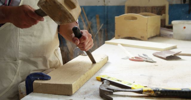 Carpenter working on his craft in his work shop