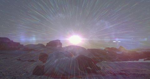 Radiant Sunrise Over Rocky Beach with Shimmering Effects