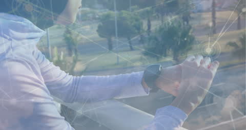 Person Using Smartwatch with Virtual Network Overlay