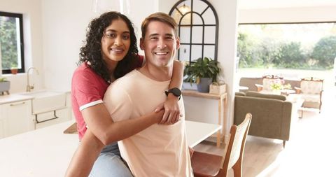 Joyful Diverse Couple Enjoying Time in Modern Kitchen