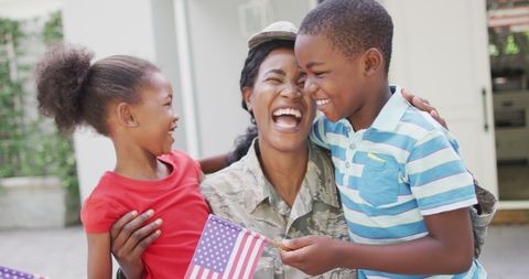Joyful Reunion of Soldier Mother with Her Children Displaying Patriotism - Download Free Stock Images Pikwizard.com