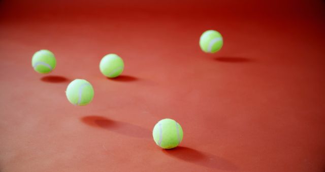 Five Tennis Balls on Red Background - Download Free Stock Images Pikwizard.com
