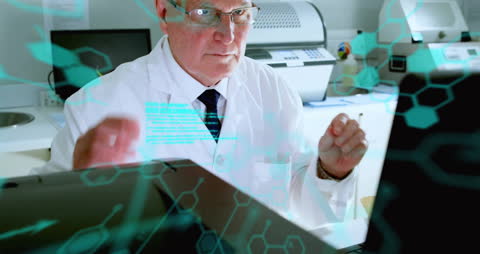 Senior Scientist Analyzing Molecular Data on Computer Screen in Laboratory