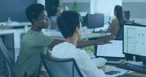 Colleagues discussing planning in shared office