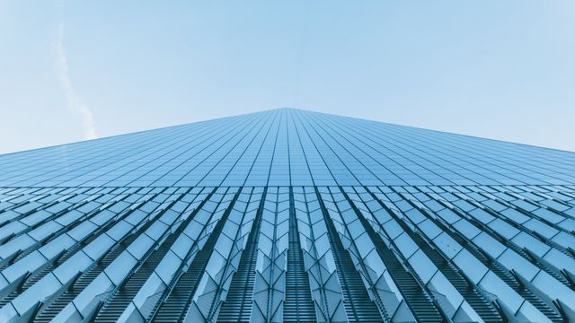 Abstract Modern Skyscraper Perspective Against Clear Sky - Download Free Stock Photos Pikwizard.com