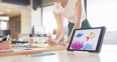 Collaborative Female Work Team Sketching Ideas in Creative Office